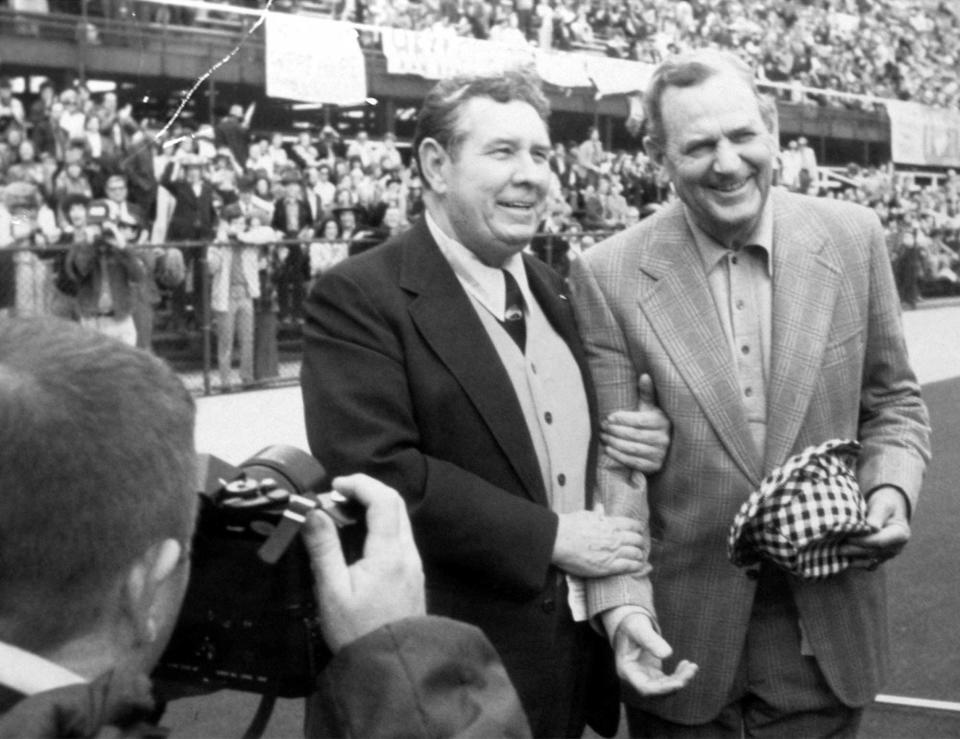 This undated file photo shows Auburn University head coach Ralph "Shug" Jordan with Alabama head coach Paul "Bear" Bryant before an Alabama vs. Auburn football game at Legion Field in Birmingham. (Tuscalooosa News Files/Calvin Hannah)