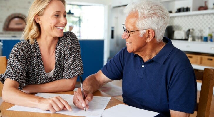 Woman helping a man complete his will