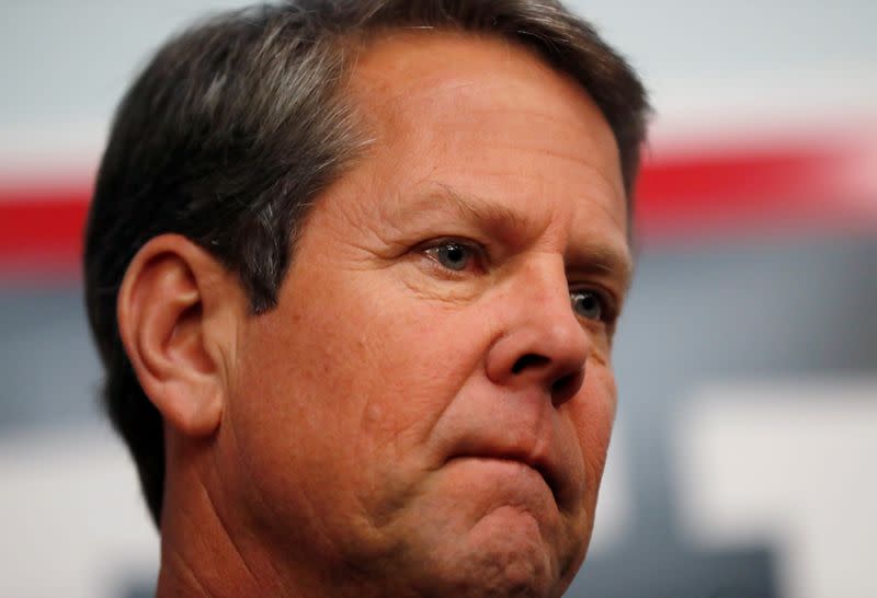 Gubernatorial candidate Brian Kemp prepares to speak to volunteers and staff at his campaign office as they hold a phone banking event in Atlanta, Georgia, U.S.