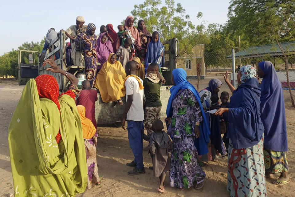 Women and children who were held captive by islamic extremists and rescued by Nigeria's army, are seen upon arrival in Maiduguri, Nigeria, Monday, May 20, 2024. Hundreds of hostages mostly children whose mothers were held captive and forcefully married by Islamic extremists in northeastern Nigeria have been rescued from their key forest enclave and handed over to authorities, the West African nation's army said late Monday. (AP Photo/Jossy Olatunji)