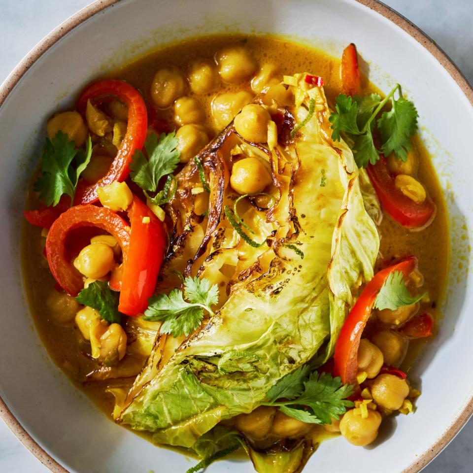 coconut braised cabbage with peppers and chickpeas in a skillet