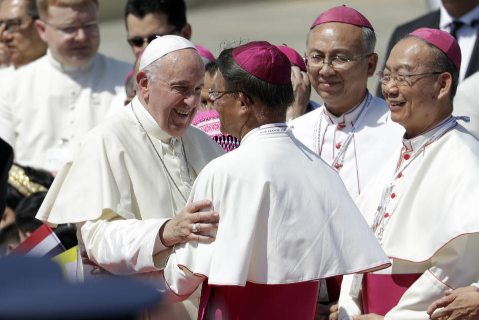 Pope Francis greets as he arrives at Military Air Terminal of Don Muang Airport, Wednesday, Nov. 20, 2019, in Bangkok, Thailand. (AP Photo/Gregorio Borgia)