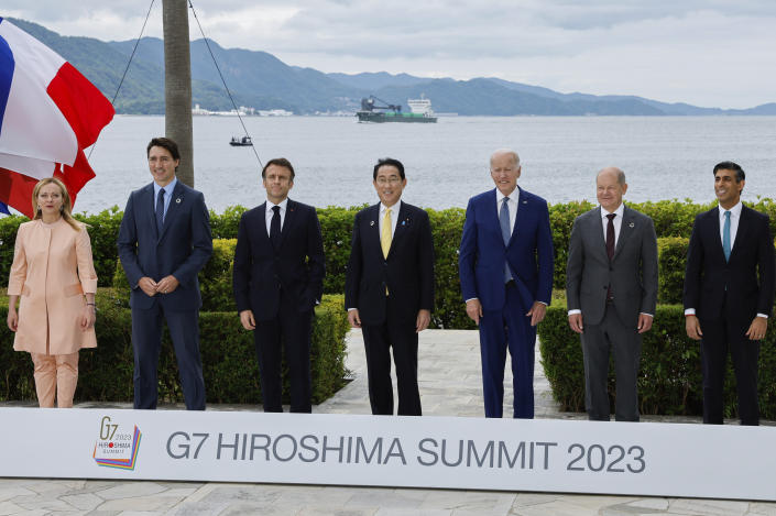 From left, Italy's Prime Minister Giorgia Meloni, Canada's Prime Minister Justin Trudeau, France's President Emmanuel Macron, Japan's Prime Minister Fumio Kishida, U.S. President Joe Biden, Germany's Chancellor Olaf Scholz and Britain's Prime Minister Rishi Sunak participate in a family photo with G7 leaders before their working lunch meeting on economic security during the G7 summit, at the Grand Prince Hotel in Hiroshima, western Japan Saturday, May 20, 2023. (Jonathan Ernst/Pool Photo via AP)