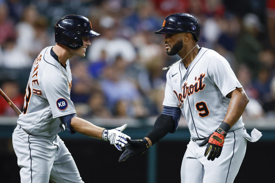 Detroit Tigers' Willi Castro (9) celebrates with Kerry Carpenter after hitting a solo home run off Cleveland Guardians starting pitcher Cal Quantrill during the sixth inning of a baseball game Wednesday, Aug. 17, 2022, in Cleveland. (AP Photo/Ron Schwane)