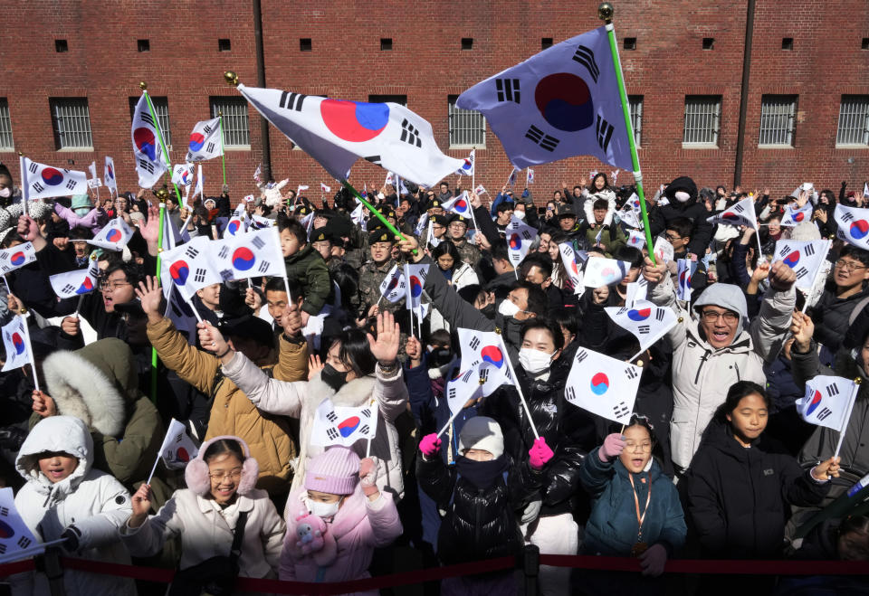 South Koreans cheer for the country during a ceremony to celebrate the March First Independence Movement Day, the anniversary of the 1919 uprising against Japanese colonial rule, in Seoul, South Korea, Friday, March 1, 2024. (AP Photo/Ahn Young-joon)