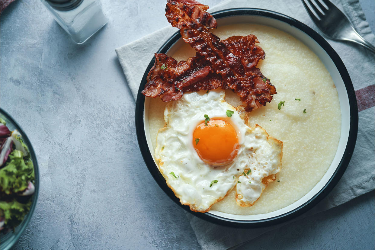 Creamy Grits with Fried Eggs and Bacon Getty Images/GMVozd