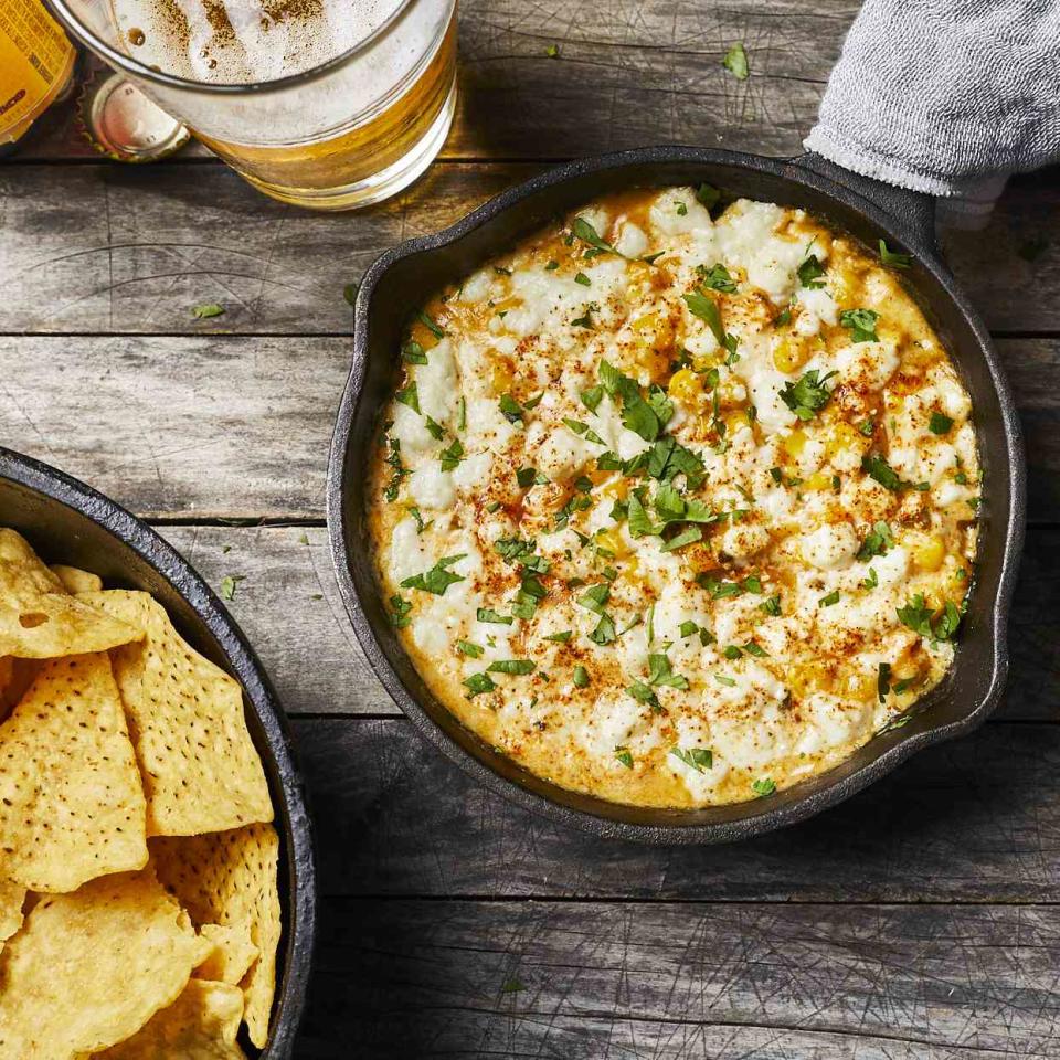 <p>Creamy melted cheese brings sweet corn and spicy jalapeño together with a nice pop of brightness from lime juice and cilantro in this tasty dip inspired by Mexican elote and esquites. This creamy and satisfying dish can be served with tortilla chips and veggies for dipping. <a href="https://www.eatingwell.com/recipe/280203/cheesy-jalapeno-corn-dip/" rel="nofollow noopener" target="_blank" data-ylk="slk:View Recipe" class="link ">View Recipe</a></p>