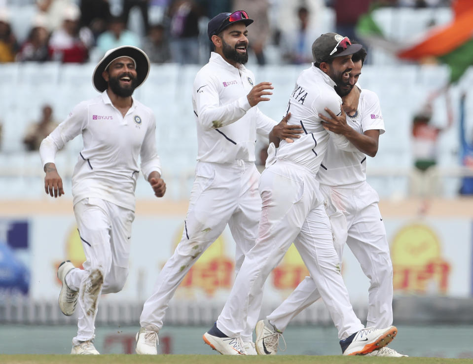 India's Sahbaz Nadeem, right, celebrates with teammates the dismissal of South Africa's Temba Bavuma during the third day of third and last cricket test match between India and South Africa in Ranchi, India, Monday, Oct. 21, 2019. (AP Photo/Aijaz Rahi)