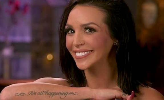 A screencap of Scheana Shay displaying her "It's all happening" tattoo