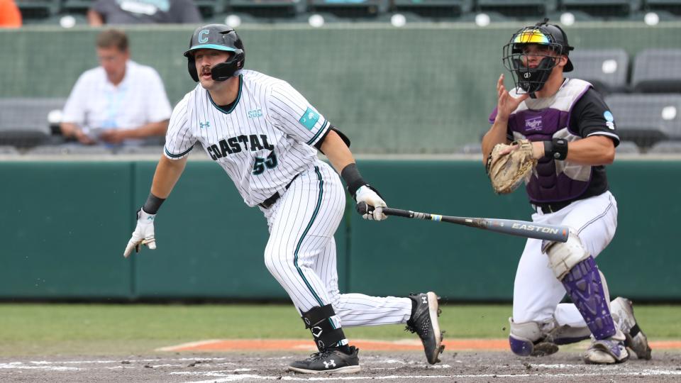 CLEMSON, SC - JUNE 02: Coastal Carolina Chanticleer catcher Derek Bender (53) puts the ball in play for a single during the NCAA Division 1 Regional College Baseball game between the High Point Panthers and the Coastal Carolina Chanticleers on June 2, 2024, at Doug Kingsmore Stadium in Clemson, S.C.   (Photo by John Byrum/Icon Sportswire via Getty Images)