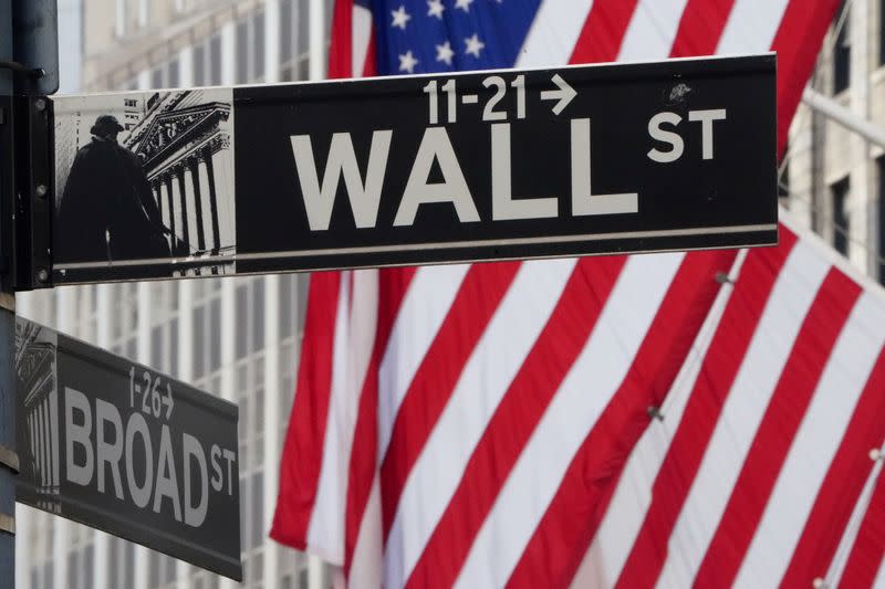 FILE PHOTO: The Wall Street sign is pictured at the New York Stock exchange (NYSE) in the Manhattan borough of New York City, U.S.
