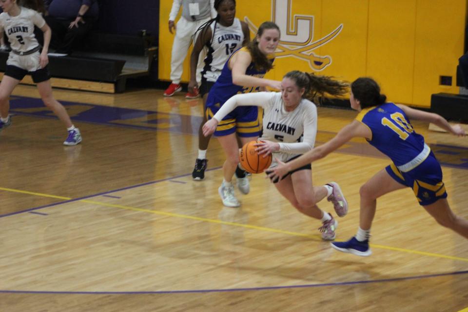 Hannah Cail makes a steal and moves upcourt against St. Vincent's Saturday.