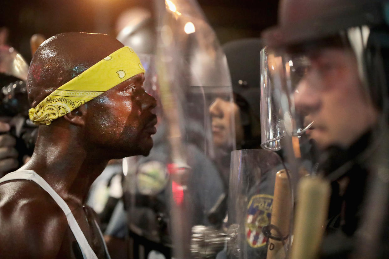 Protesters and police officers in St. Louis, Missouri stare each other down on September 16, 2017. (Getty Images)