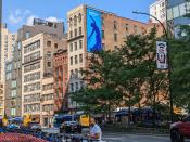 <p>A picture from the Pixel 6a's camera, featuring colorful NYC buildings. A blue banner hangs on the side of one of them.</p> 