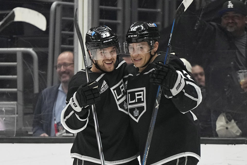 Los Angeles Kings left wing Trevor Moore, right, celebrates his goal with left wing Viktor Arvidsson during the second period of an NHL hockey game against the Seattle Kraken Wednesday, April 3, 2024, in Los Angeles. (AP Photo/Mark J. Terrill)