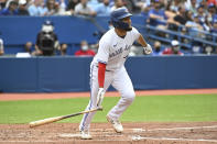 Toronto Blue Jays' Breyvic Valera watches his two-run home run in the fourth inning of a baseball game against the Oakland Athletics in Toronto on Saturday, Sept. 4, 2021. (Jon Blacker/The Canadian Press via AP)