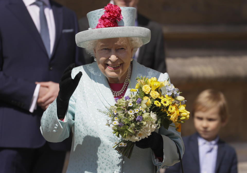 Britain's Queen Elizabeth II waves to the public as she leaves after attending the Easter Mattins Service at St. George's Chapel, at Windsor Castle in England Sunday, April 21, 2019. (AP Photo/Kirsty Wigglesworth, pool)