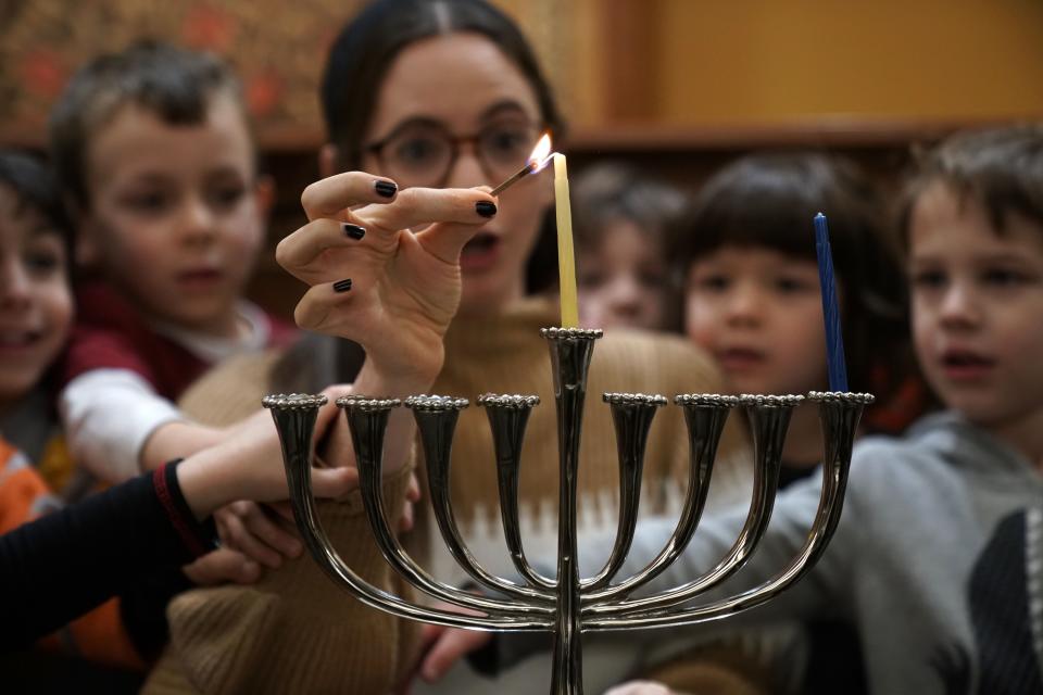 The Hanukkah menorah has nine candles. Eight of them are sacred, so they can't be used to light the temple, the home or each other. The ninth is called the "shamash," which means servant. It isn't sacred, and its sole purpose is to light the other candles.