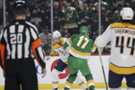 Nashville Predators right wing Michael McCarron (47) fights with Minnesota Wild left wing Marcus Foligno (17) during the first period of an NHL hockey game Sunday, March 10, 2024, in St. Paul, Minn. (AP Photo/Stacy Bengs)