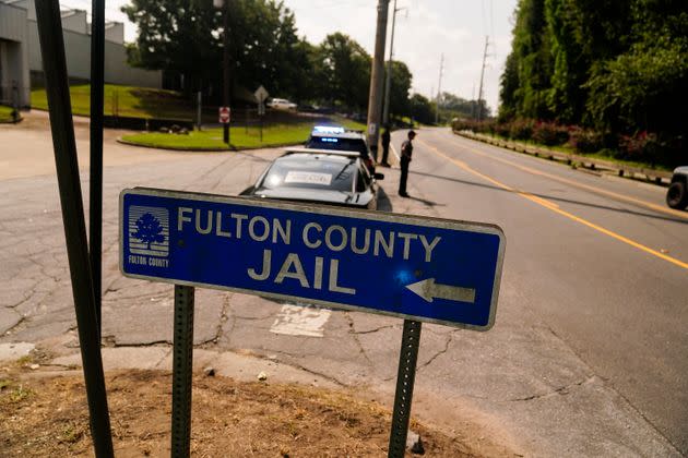 A sign pointing to Fulton County Jail in Atlanta.