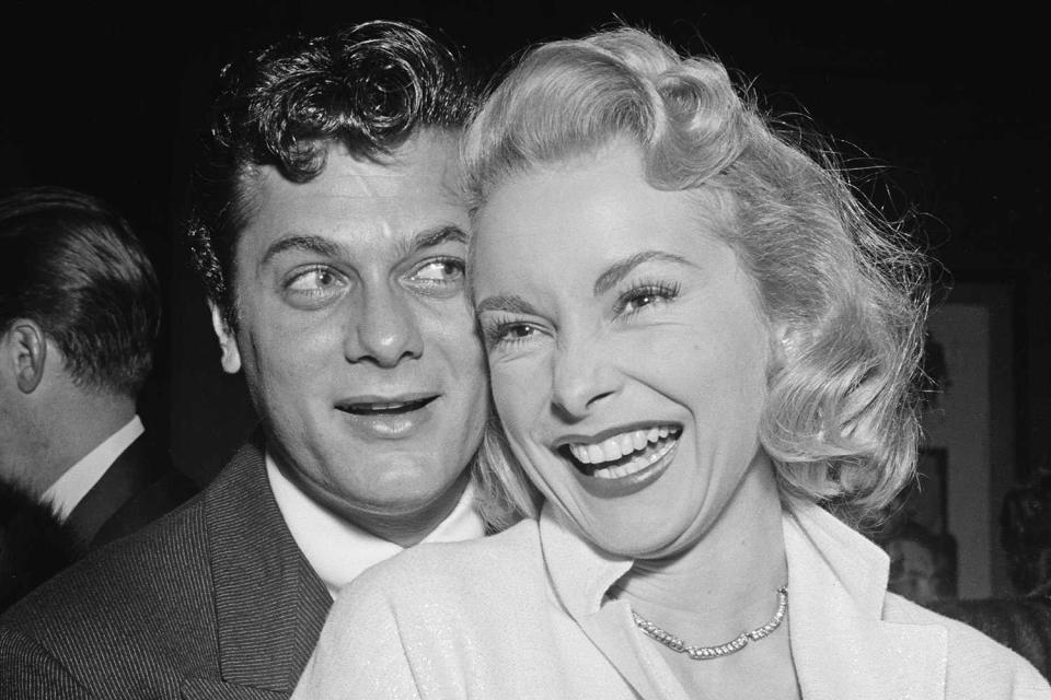 <p>Earl Leaf/Michael Ochs Archives/Getty </p> Tony Curtis and Janet Leigh on Dec. 10, 1953, at the premiere of "The Glenn Miller Story."