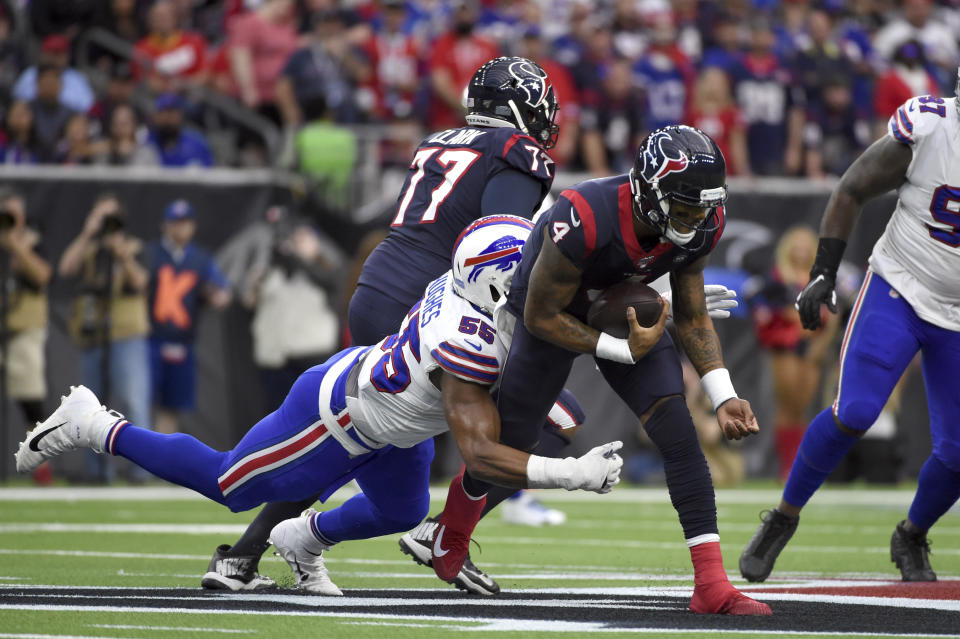 Houston Texans quarterback Deshaun Watson (4) is tackled by Buffalo Bills defensive end Jerry Hughes (55) during the first half of an NFL wild-card playoff football game Saturday, Jan. 4, 2020, in Houston. (AP Photo/Eric Christian Smith)