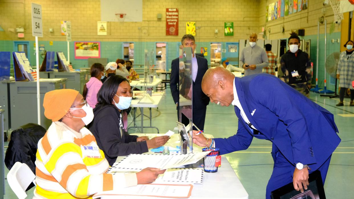 Democratic mayoral candidate Eric Adams checks in with poll workers before voting himself as the next New York City Mayor Tuesday morning, Nov. 2, 2021.
