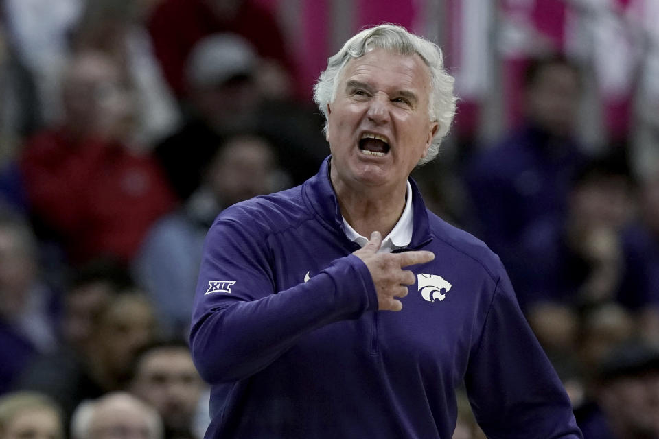 Kansas State coach Bruce Webber talks to players during the first half of the team's NCAA college basketball game against West Virginia in the first round of the Big 12 Conference tournament in Kansas City, Mo., Wednesday, March 9, 2022. (AP Photo/Charlie Riedel)