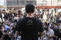 Spokesperson of Hong Kong Alliance in Support of Patriotic Democratic Movements of China, Richard Tsoi speaks to media after the group announced that it's disbanded in Hong Kong, Saturday, Sept. 25, 2021. The Hong Kong group that had organized annual vigils in remembrance of victims of the Chinese military’s crushing of the 1989 Tiananmen Square pro-democracy protests voted to disband Saturday amid an ongoing crackdown on independent political activism in the semi-autonomous Chinese city. (AP Photo/Kin Cheung)