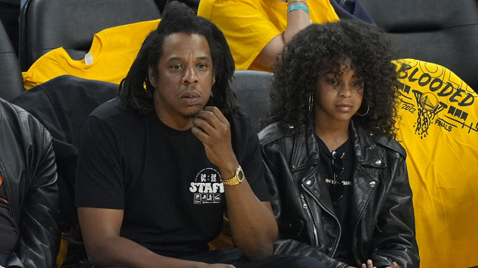 SAN FRANCISCO, CALIFORNIA - JUNE 13: Rapper Jay-Z and his daughter Blue Ivy Carter look on during the second quarter of Game Five of the 2022 NBA Finals between the Boston Celtics and the Golden State Warriors at Chase Center on June 13, 2022 in San Francisco, California. NOTE TO USER: User expressly acknowledges and agrees that, by downloading and/or using this photograph, User is consenting to the terms and conditions of the Getty Images License Agreement. (Photo by Thearon W. Henderson/Getty Images)