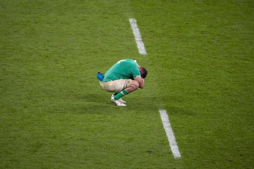 Ireland's Tadhg Beirne sits on the field at the end of the Rugby World Cup quarterfinal match between Ireland and New Zealand at the Stade de France in Saint-Denis, near Paris, Saturday, Oct. 14, 2023. (AP Photo/Themba Hadebe)