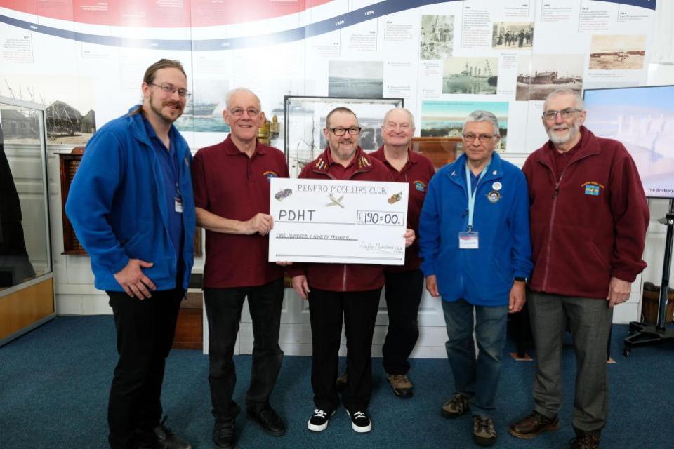 Western Telegraph: The Pembroke Dock Heritage Centre’s David Howell and Rik Saldanha are pictured with David Woolnough, Paul Emens, Derek Church and Peter Mitchell.