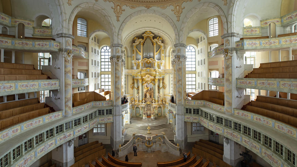 Visitors walk in the Frauenkirche cathedral (Church of Our Lady) in Dresden, Germany, Tuesday, Feb. 11, 2020 two days before the 75th anniversary of the Allied bombing of Dresden during WWII. British and U.S. bombers on Feb. 13-14, 1945 destroyed Dresden's centuries-old baroque city center. (AP Photo/Jens Meyer)