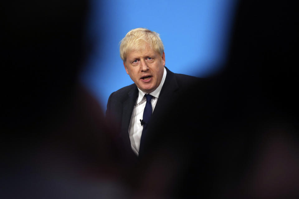 Conservative party leadership candidate Boris Johnson answers questions during a Conservative leadership hustings at ExCel Centre in London, Wednesday, July 17, 2019. The two contenders, Jeremy Hunt and Boris Johnson are competing for votes from party members, with the winner replacing Prime Minister Theresa May as party leader and Prime Minister of Britain's ruling Conservative Party. (AP Photo/Frank Augstein)