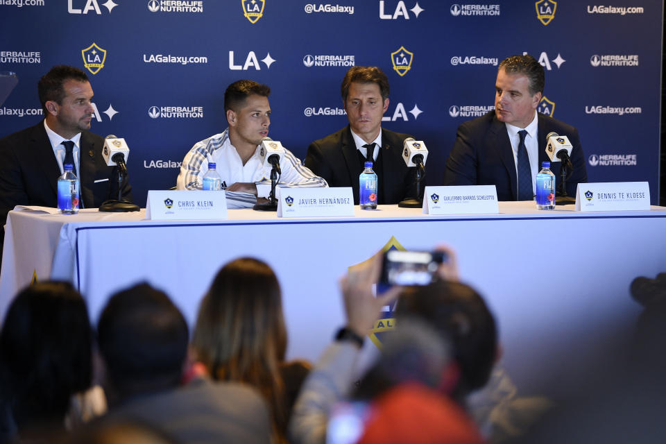 Los Angeles Galaxy's Javier "Chicharito" Hernández, second from left, is introduced during a press conference with head coach Guillermo Barros Schelott, second from right, general manager Dennis te Kloese, right, and president Chris Klein in Carson, Calif., Thursday, Jan. 23, 2020. (AP Photo/Kelvin Kuo)