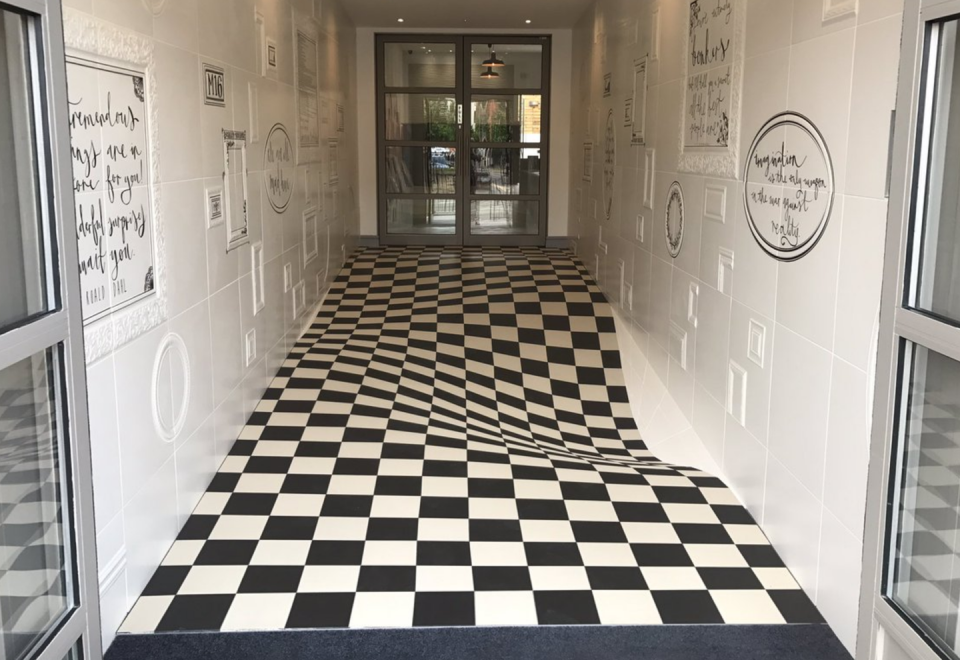 <p>This <a href="https://www.popularmechanics.com/science/news/a28572/tile-floor-optical-illusion/" rel="nofollow noopener" target="_blank" data-ylk="slk:waving tile floor;elm:context_link;itc:0;sec:content-canvas" class="link ">waving tile floor</a> is the result of careful tile cutting, creating an illusion of forced perspective. For people in older apartment buildings, this could just look like a bad maintenance day.</p>