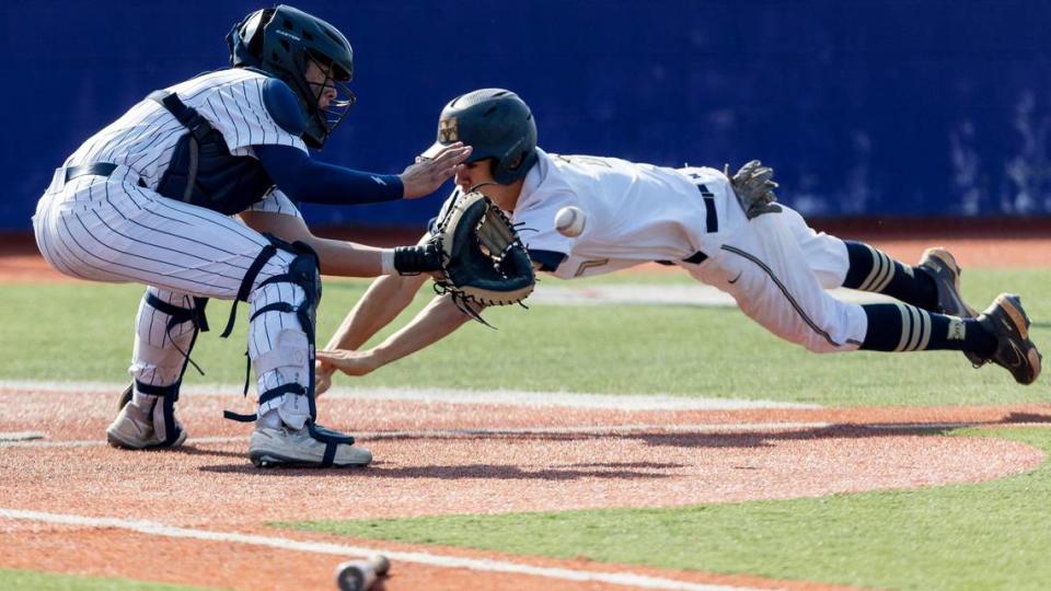 Middleton pinch runner Beau Ramsey is tagged out by Lake City catcher Cooper Smith at home plate in the bottom of the fifth inning as part of a double play that ended the Vikings’ best chance at tying the game.