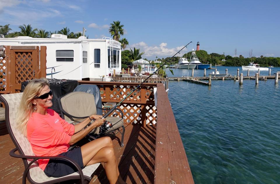 Suni Sands Mobile Home Park resident Jan West enjoys fishing from her deck directly on the Jupiter inlet on October 15, 2015.