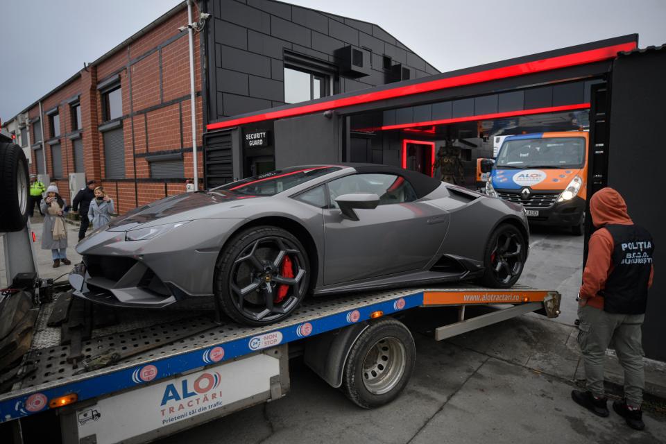Police seize luxuy cars from Tate’s house on Saturday (Copyright 2022 The Associated Press. All rights reserved)