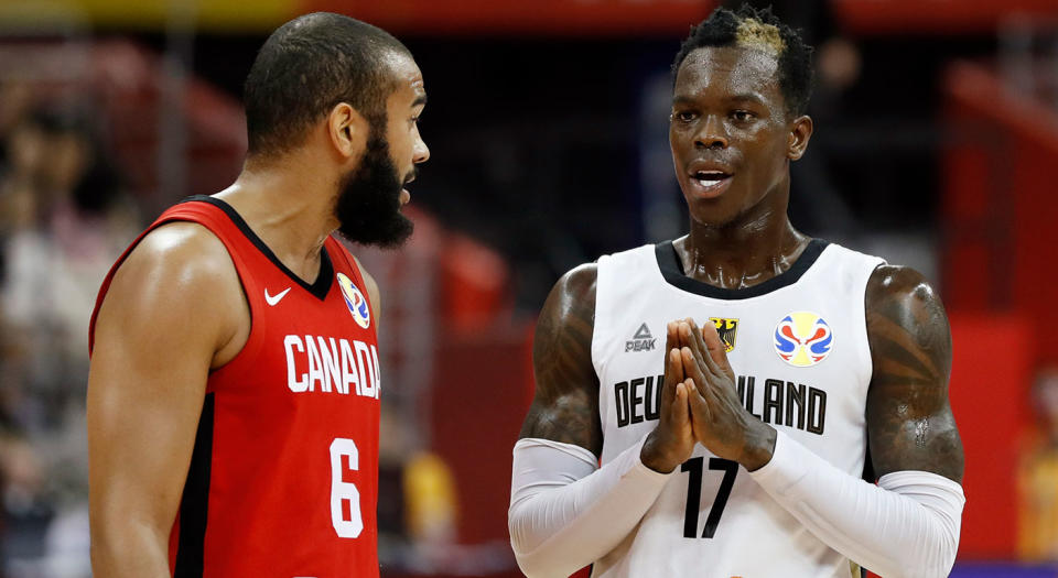 Germany's Dennis Schroder talks to Canada's Cory Joseph. (REUTERS/Aly Song)