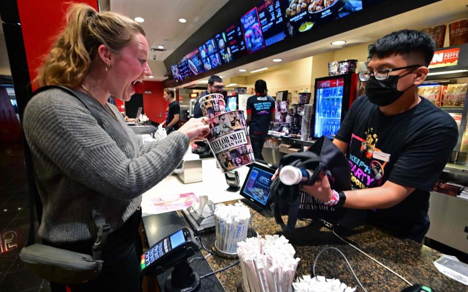 A Taylor Swift fan before seeing the Eras Tour movie at an AMC cinema in Los Angeles