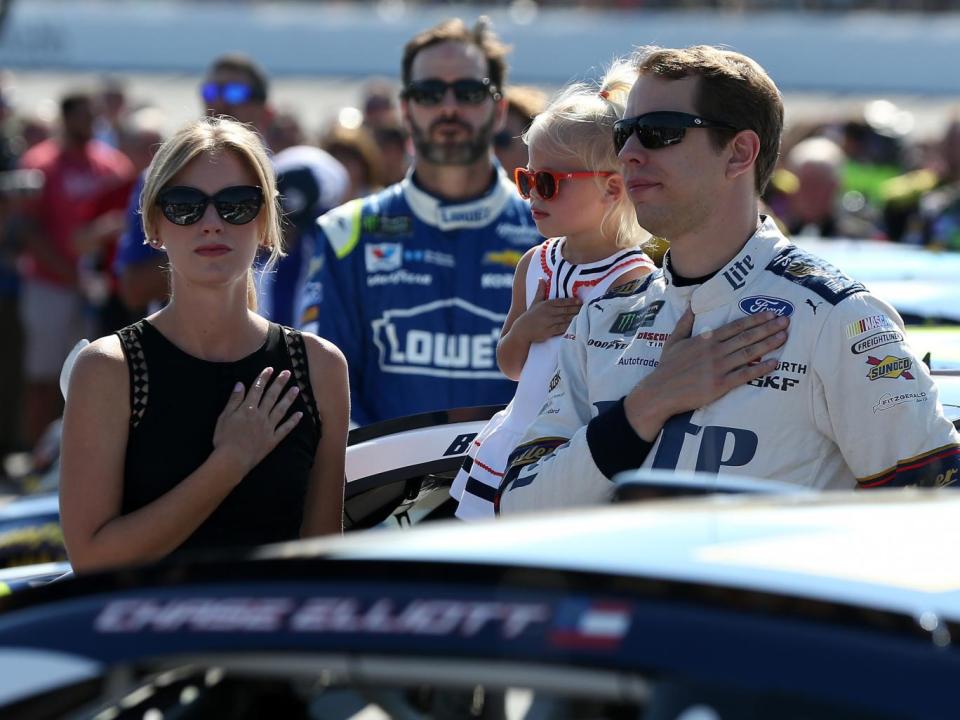 Brad Keselowski honours the American national anthem ahead of the Nascar race at New Hamshire Motorspeedway (Getty)