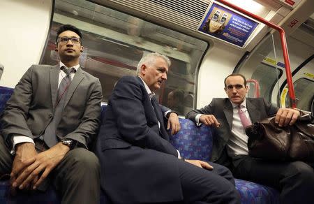 Men travel on the London underground in London, Britain August 5, 2015. REUTERS/Paul Hackett