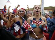 USA fans (R-L) Lindsay Beeder, 19, Shayda Ansari, 21, Lauryn De La Torre, 19, and Paige Conway, 18, react during the 2014 World Cup Group G soccer match between Germany and the U.S. at a viewing party in Hermosa Beach, California June 26, 2014. REUTERS/Lucy Nicholson (UNITED STATES - Tags: SPORT SOCCER WORLD CUP TPX IMAGES OF THE DAY)