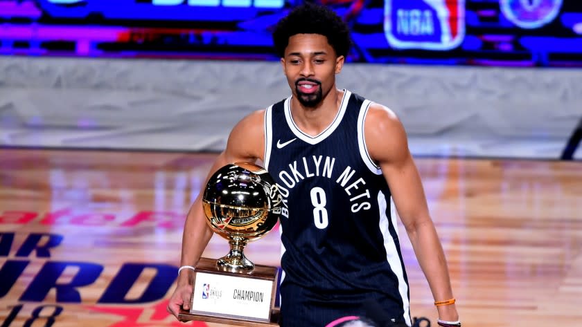 Spencer Dinwiddie poses with the Skills Challenge Trophy after winning the competition on Saturday night at Staples Center.