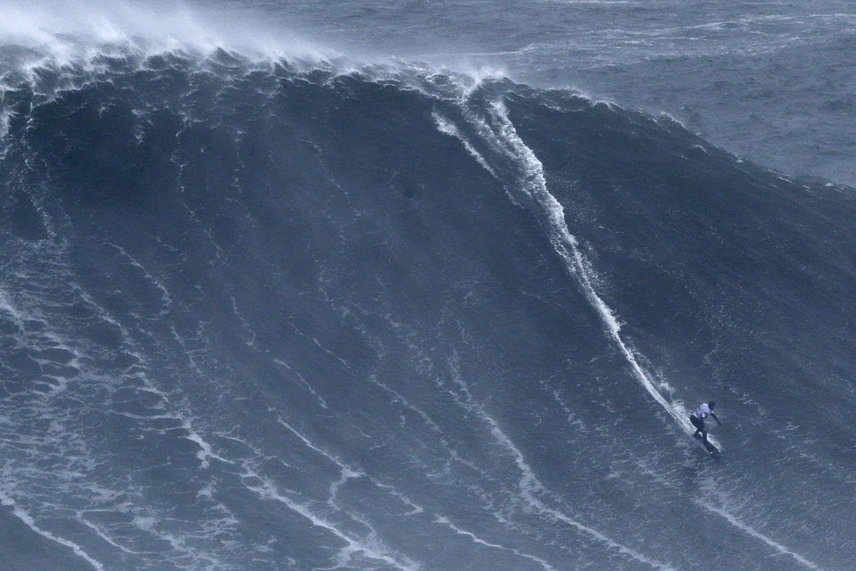 Maya Gabeira from Brazil rides a wave during the Nazare Tow Surfing Challenge at Praia do Norte or North Beach in Nazare, Portugal, Tuesday, Feb. 11, 2020. (AP Photo/Armando Franca)