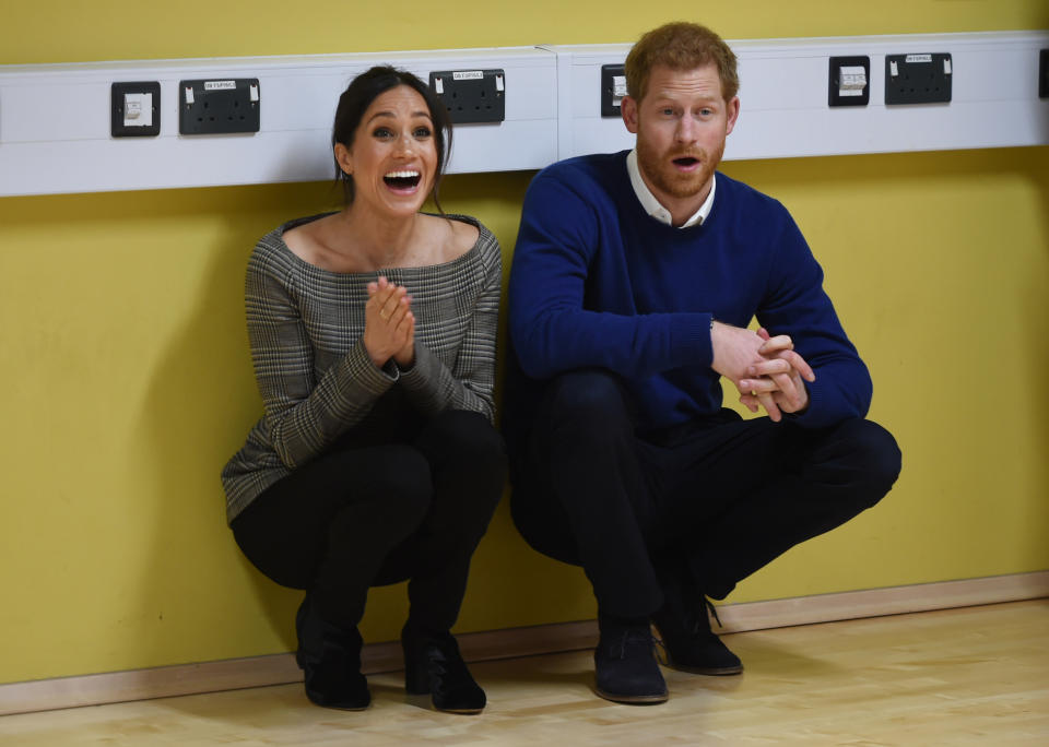 Britain's Prince Harry and Meghan Markle attend a street dance class during their visit to Star Hub community and leisure centre in the Tremorfa area of Cardiff, south Wales