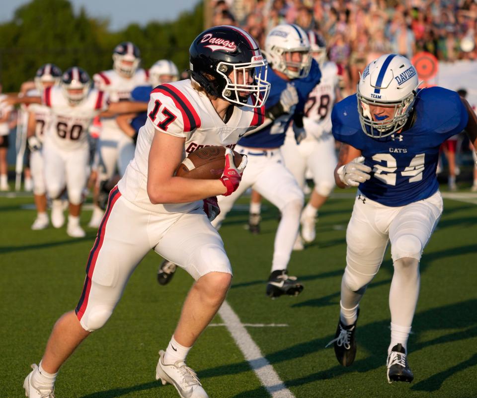 Grove City's Parker Toadvine tries to outrun Hilliard Davidson's Riley Johnson during their game Friday. Grove City hosts Thomas Worthington in Week 3, while Davidson visits Dublin Jerome.