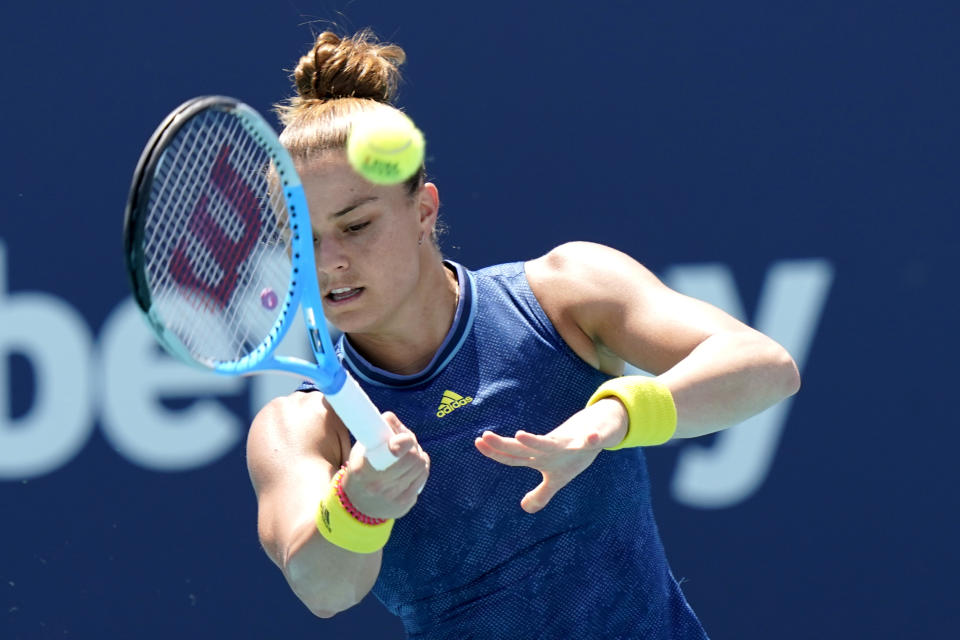 Maria Sakkari, of Greece, hits a return to Naomi Osaka, of Japan, during the quarterfinals of the Miami Open tennis tournament, Wednesday, March 31, 2021, in Miami Gardens, Fla. Sakkari won 6-0, 6-4. (AP Photo/Lynne Sladky)