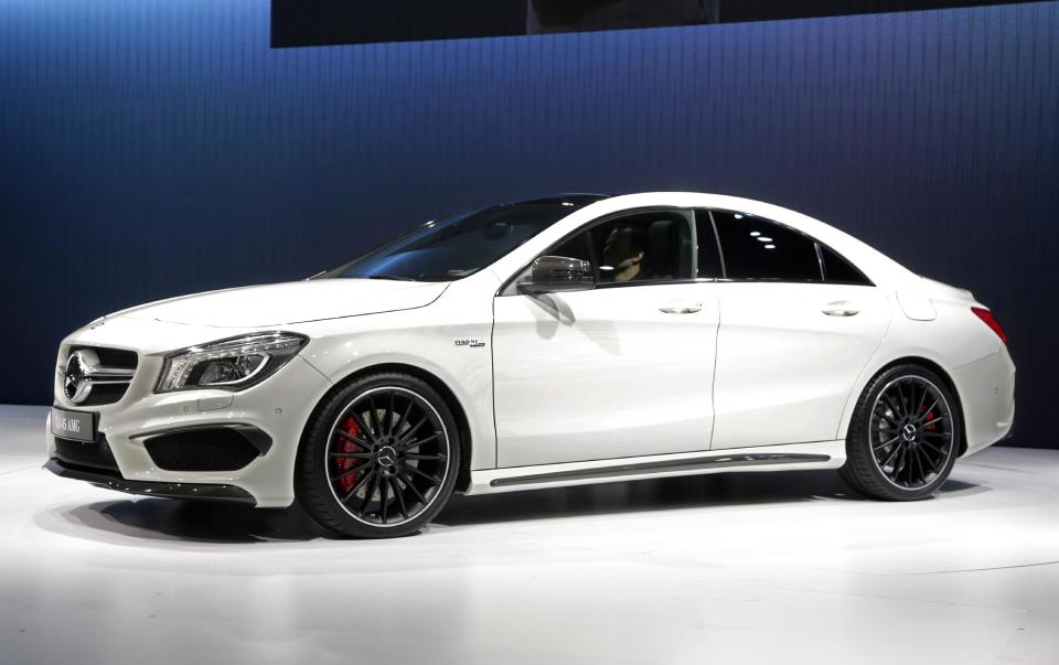 FILE - In this March 27, 2013 file photo, the 2014 CLA 45 AMG Mercedes-Benz is presented at the New York International Auto Show, in the Javits Center, in New York. The CLA 45 AMG all-wheel-drive with 355 horses goes on sale in November. (AP Photo/Richard Drew, File)